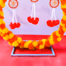 Beautiful hangings swing as the wind blows, and diyas light up around the idol