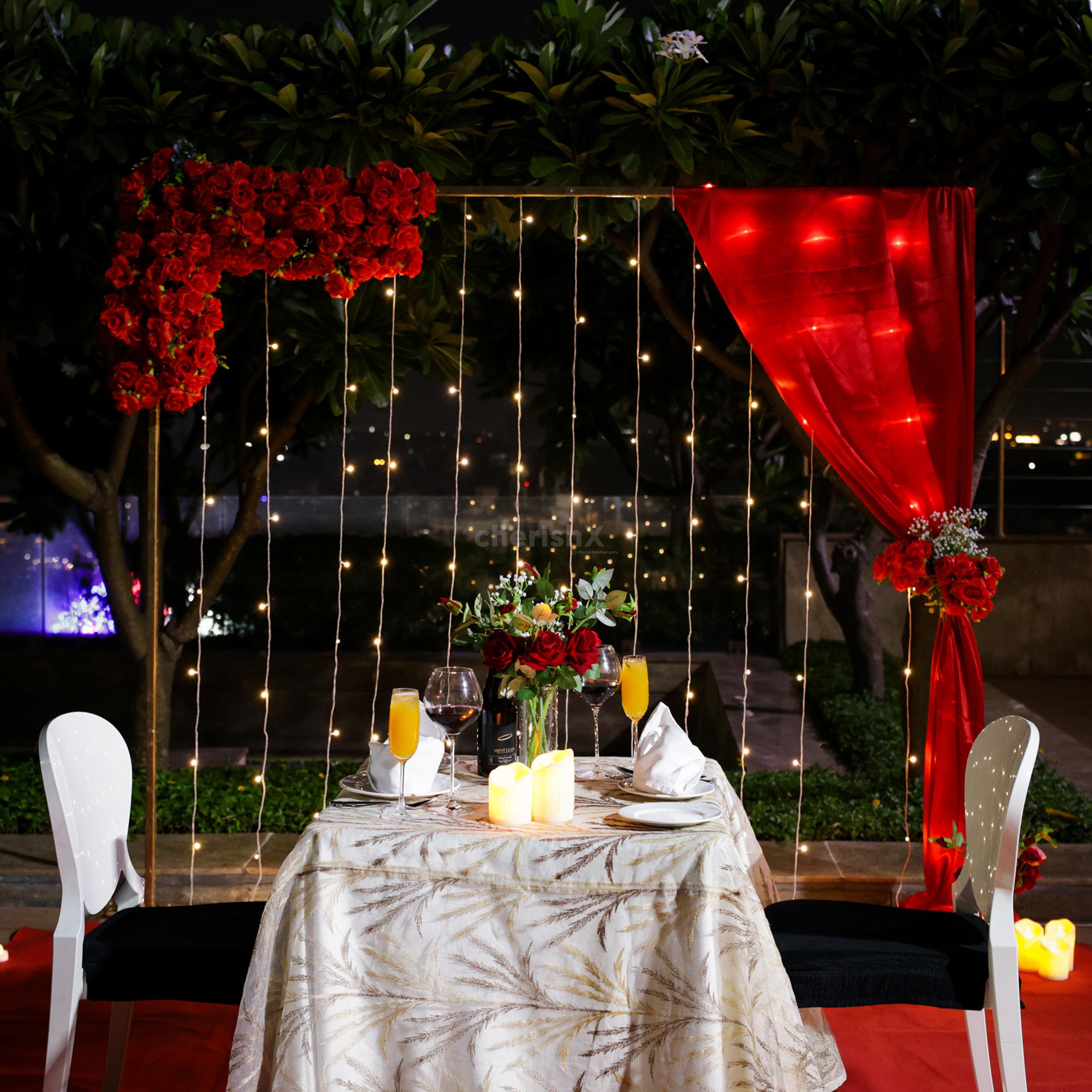red proposal decor with roses and romantic vibes