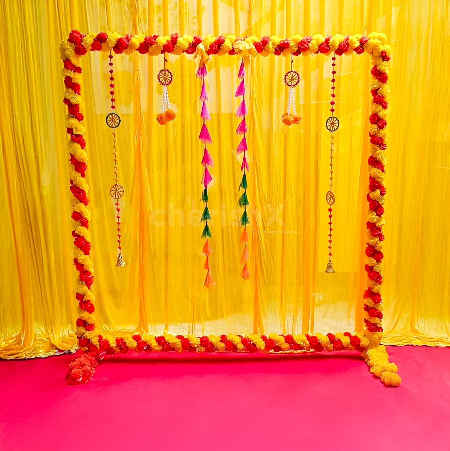 Orange and yellow marigold garlands are ideal for Ganpati sending holy vibes