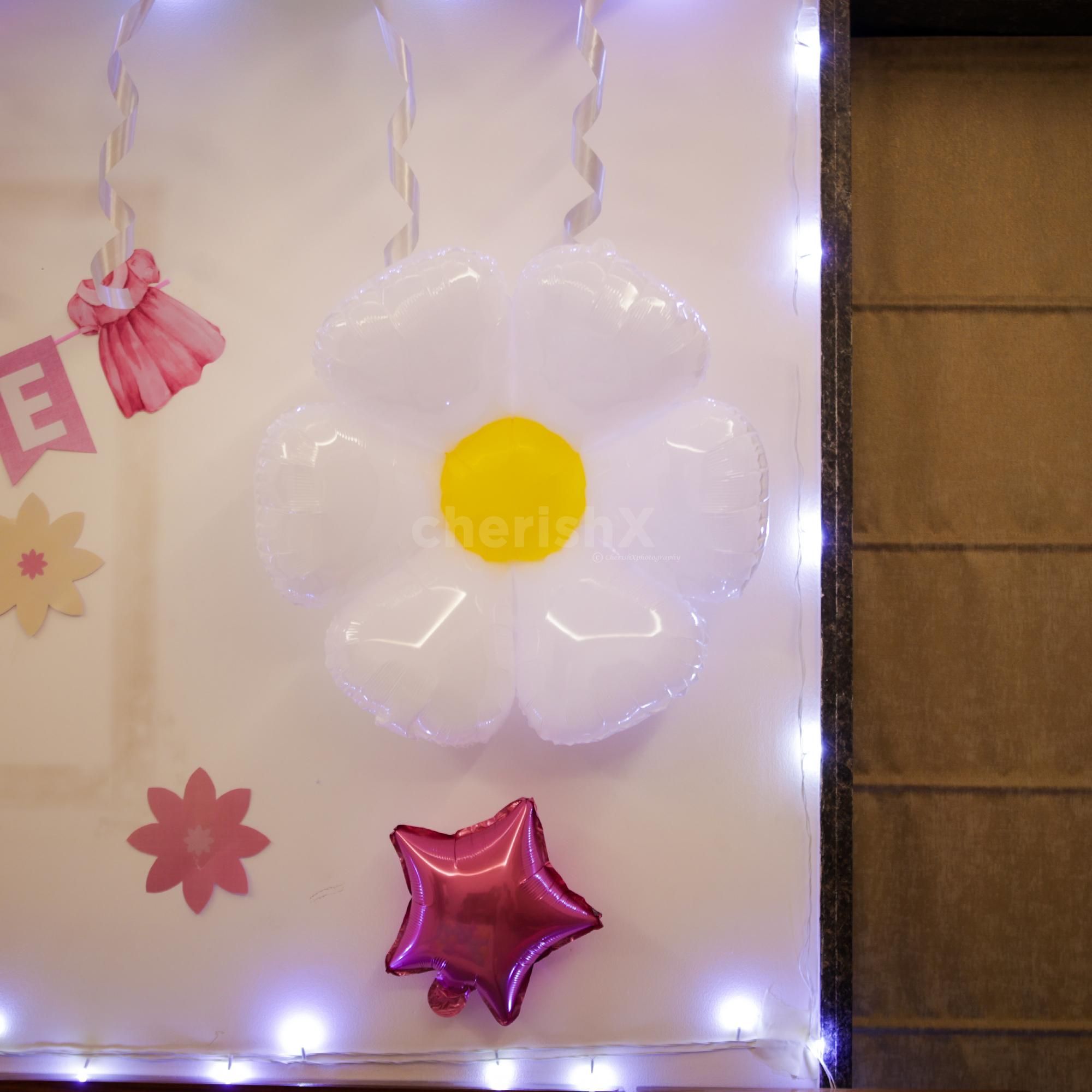 Rosette details and pops of color add to the happy mood.