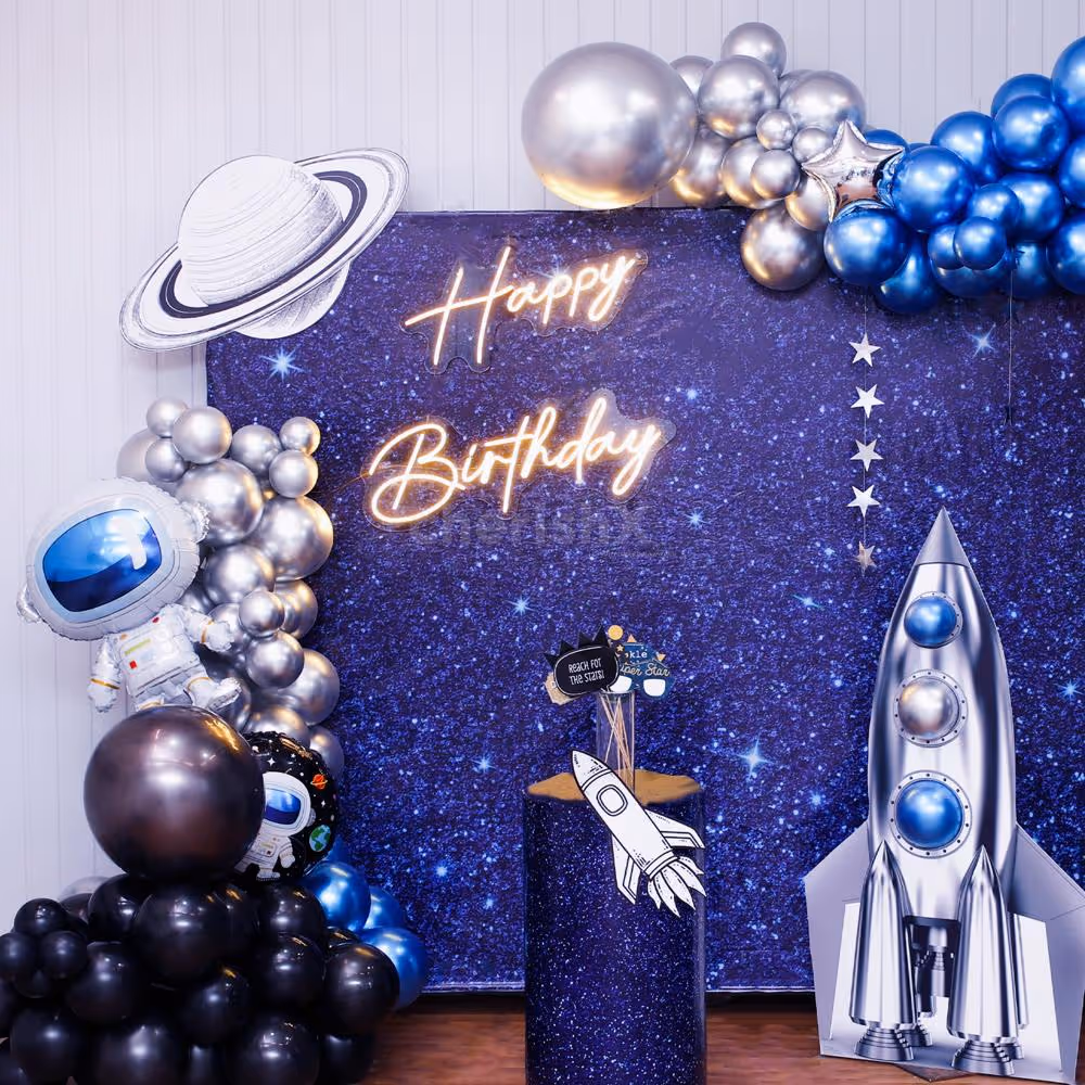 A dramatic balloon arch in metallic tones and polka dot pops.