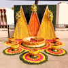 Floral triangle backdrop emitting haldi & mehendi magic.