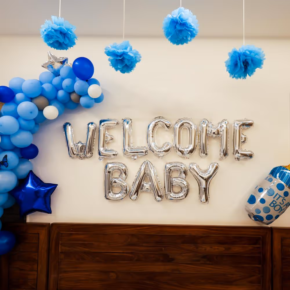 Fluffy pastel balloons fill the bed for a fun and welcoming atmosphere.