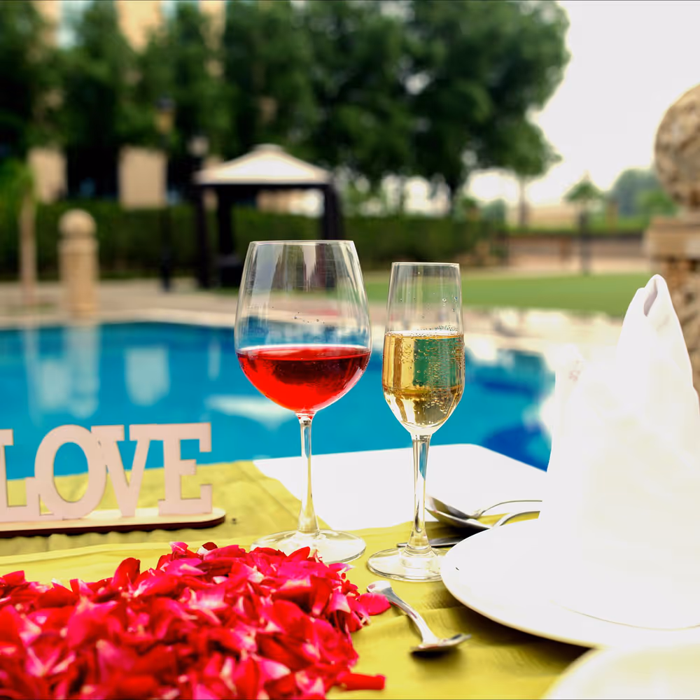 anniversary celebration decor, poolside decor, poolside romantic dining in noida