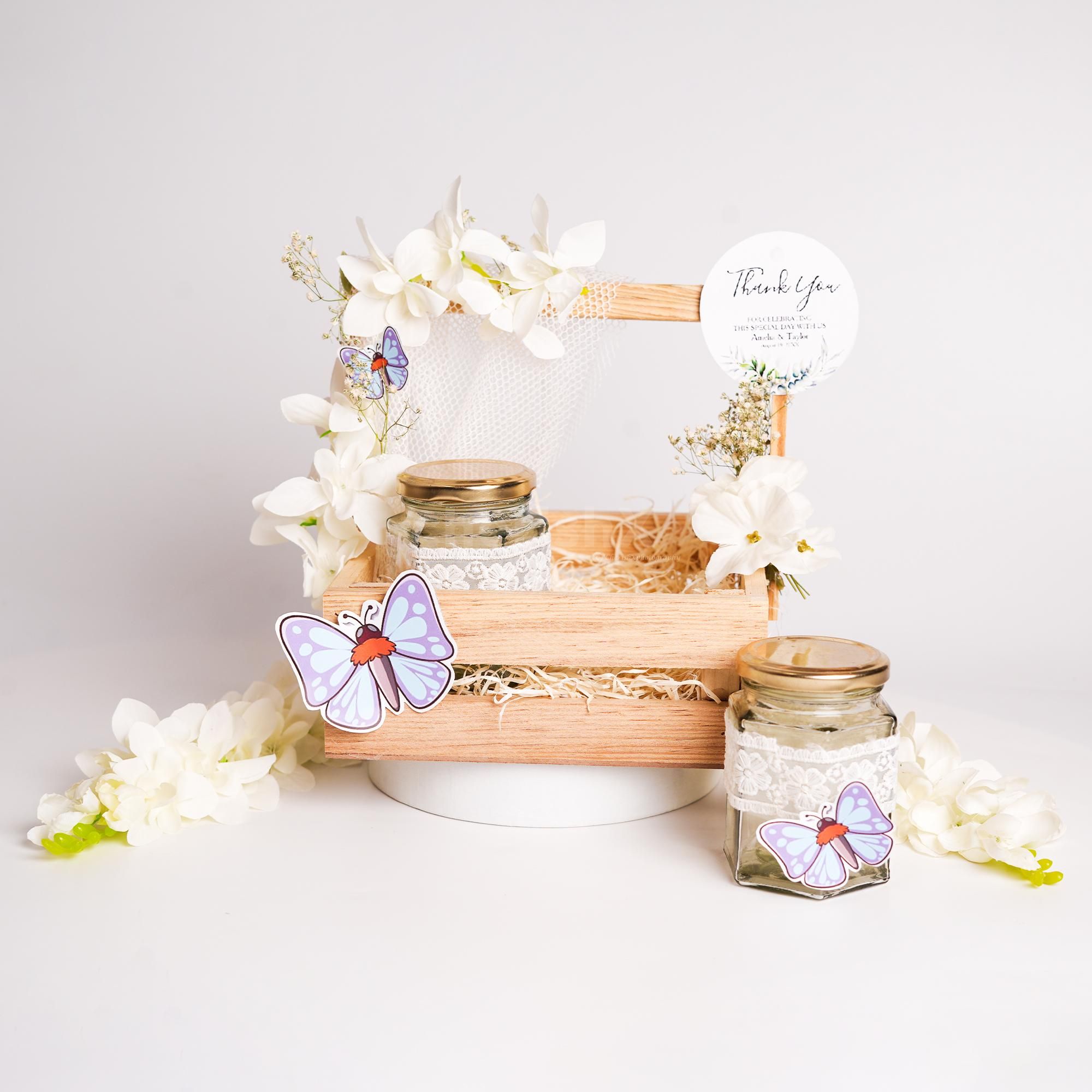 Exquisite white flowers and subtle touches create a classic gift.
