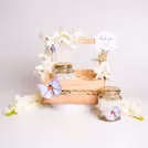 Exquisite white flowers and subtle touches create a classic gift.
