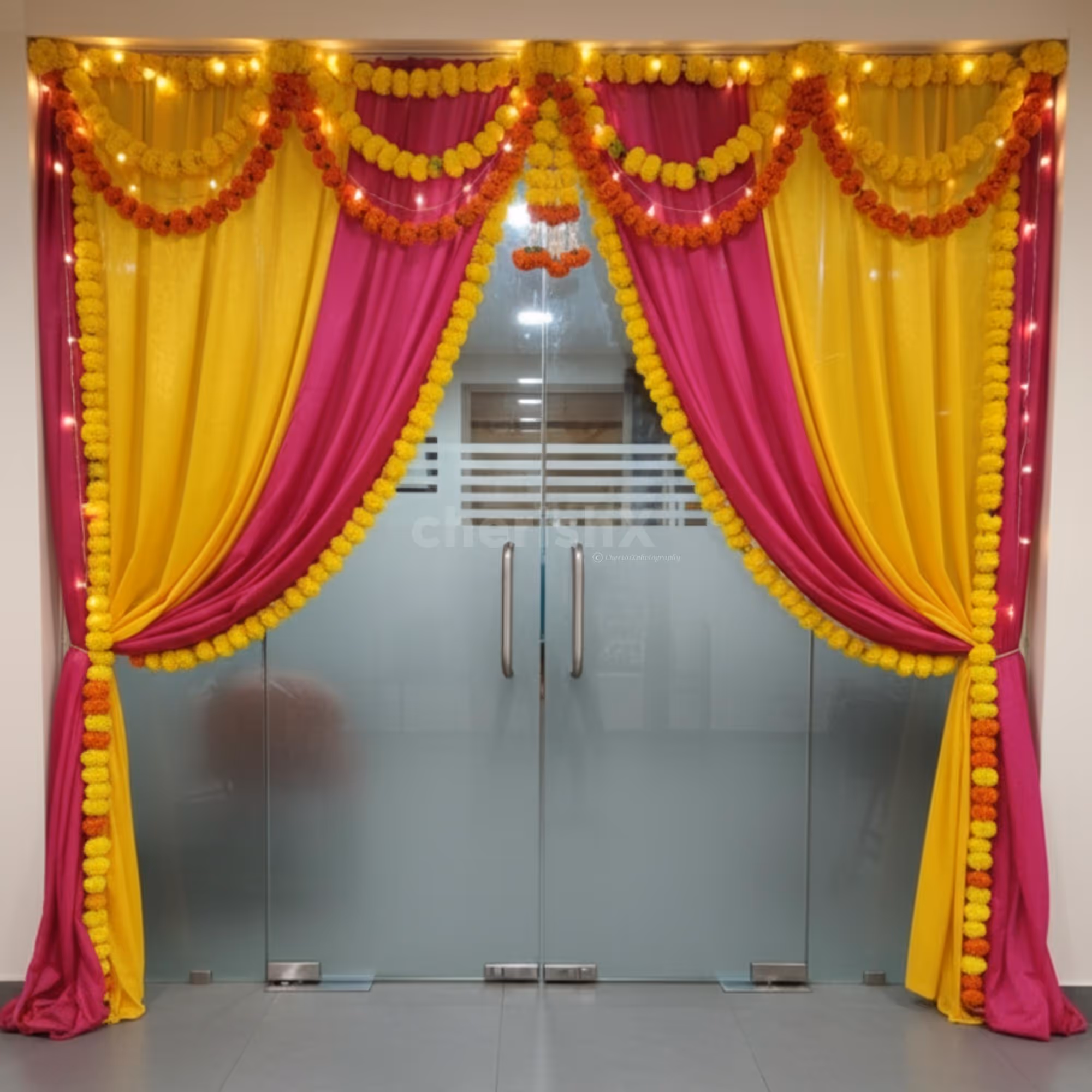 Bright drapes and tassels frame a festive welcome zone.