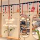 Golden balls shimmer and reflect the fairy light glow, making a dreamy decor