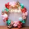 Cascading pink and pastel tones create a dreamy baby shower backdrop