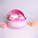 Light pink shades and tiny lace trimming create a period treasure.