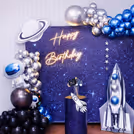 A dramatic balloon arch in metallic tones and polka dot pops.