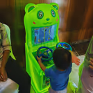 Children play racing games with a working steering wheel for an actual car experience
