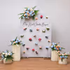 Engagement decor with a mix of single and multicolor flower bunches