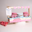 Soft pastel colours and gentle ornamentation make for a lovely memento.