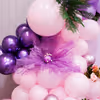 Purple organza flowers enhance the soft sheer texture and gentle color of other floral elements