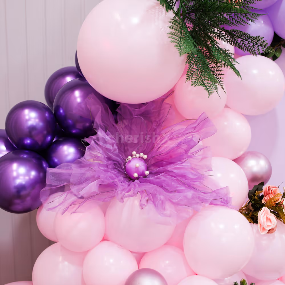 Purple organza flowers enhance the soft sheer texture and gentle color of other floral elements