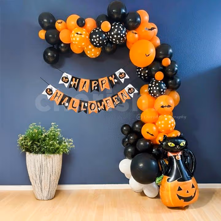 Multicolored balloons, bunting, and flying bat details celebrate Halloween spirit.