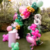 Flamingo props lend a whimsical touch to the birthday scene.