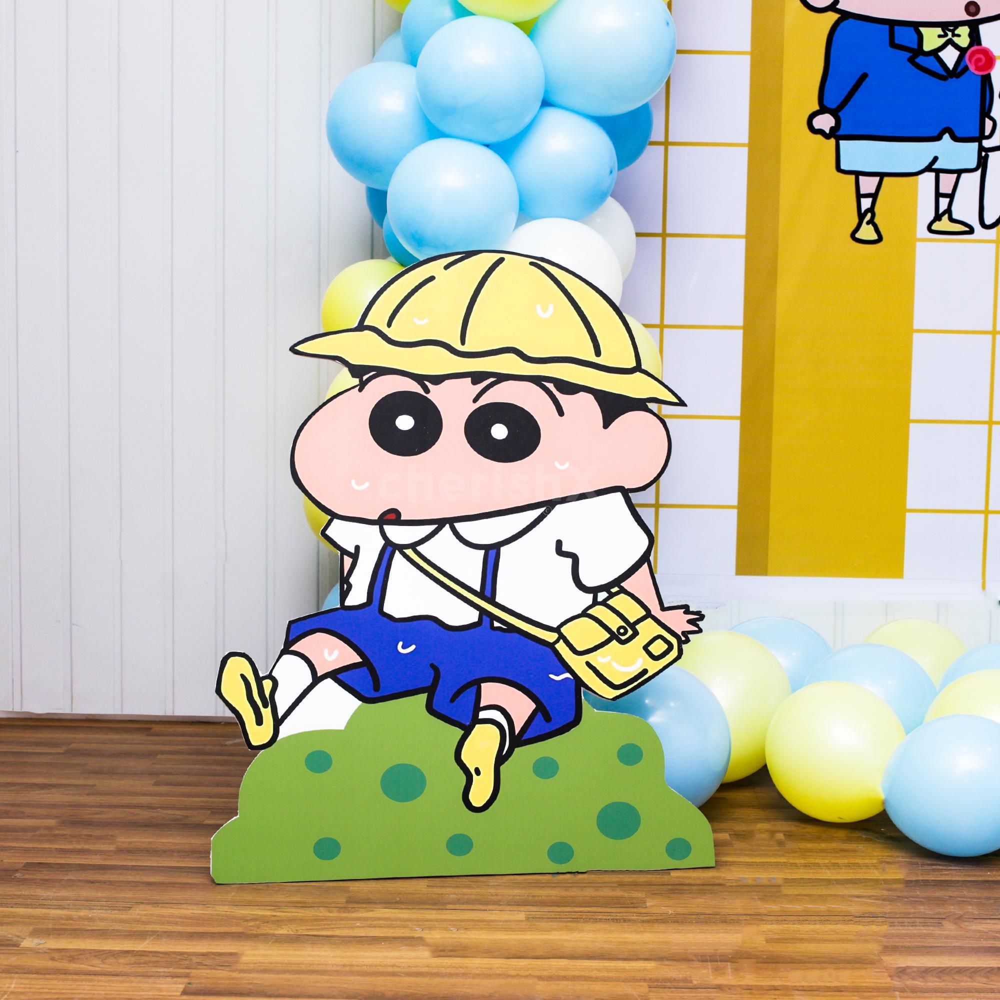 A softer blue, white, and yellow balloon arch encircles the party.