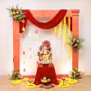Fresh flower petals and red fabric incorporate the freshness needed for prayers