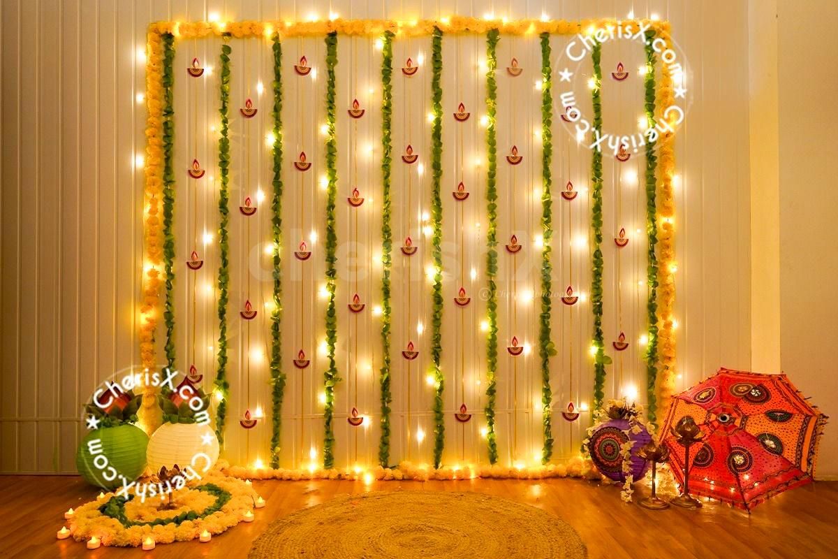 Diwali wall decor with pan strings, garlands, and fairy lights