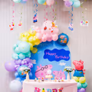 Ceiling balloon bunches lift the mood at peppa pig birthday bash