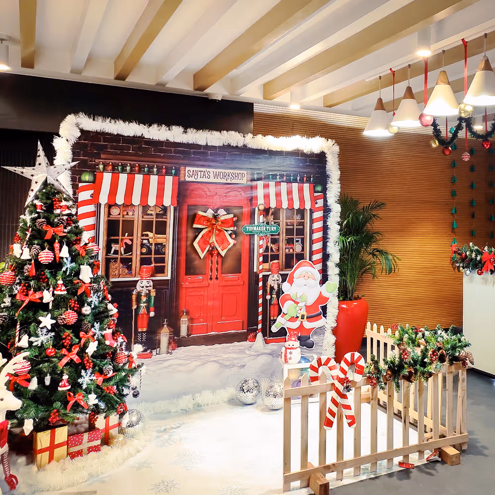 Reindeer, Santa, tree, and snowman highlight festive elements.