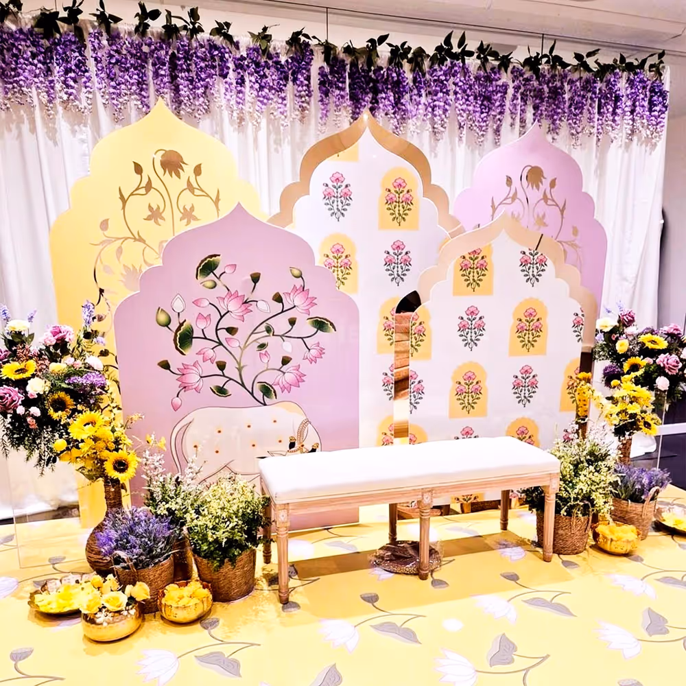 Royal pastel arch panels with floral paintings form a dreamy background.