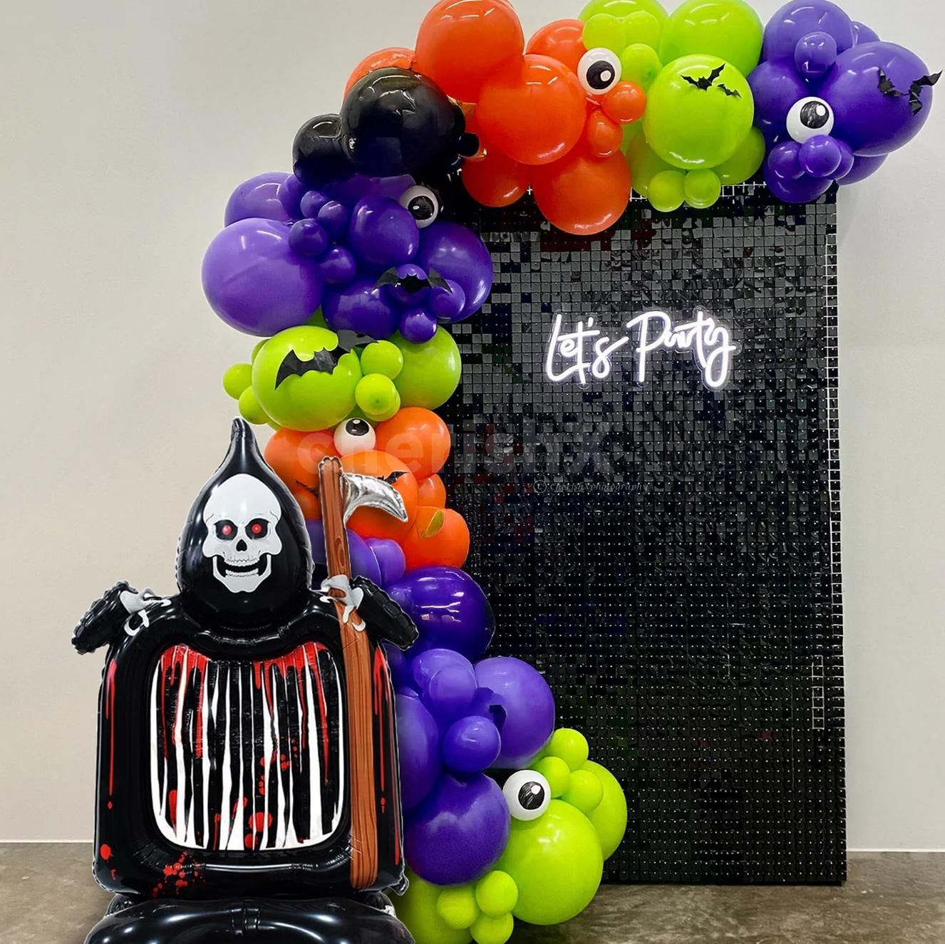 Sparkling details will add glam and glow to your Halloween backdrop.