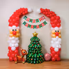Santa pillar with multiple latex balloons and paper eyes turns wall decor eye-catching