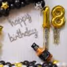 Black white golden and silver balloons for birthday that celebrates ageing
