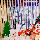 Candy cutouts, candy sticks, and mosses add playfulness to the Christmas backdrop decor