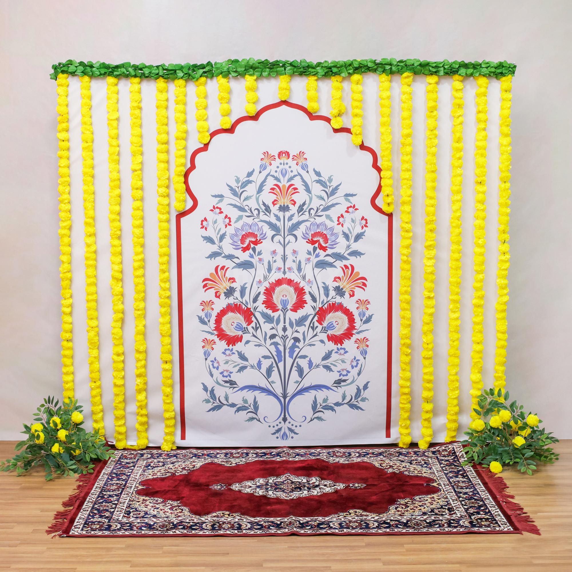 Pan leaves garland makes a colourful curtain in the backdrop of the idol