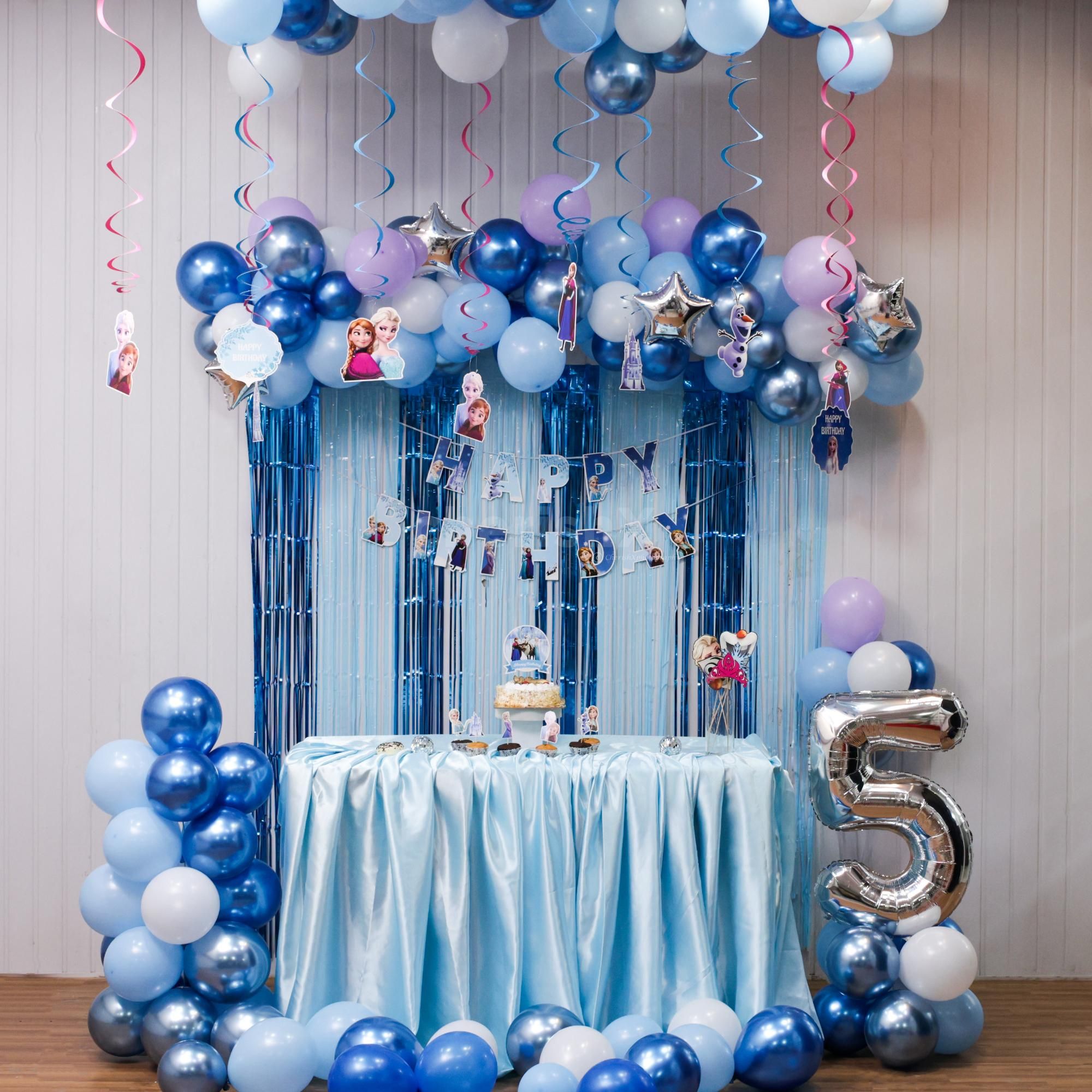 Frozen-themed balloon arch with bunting and toppers steals the party show