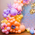 Cupcake and popsicle cutouts highlight the sweet-theme vibes and draw attention