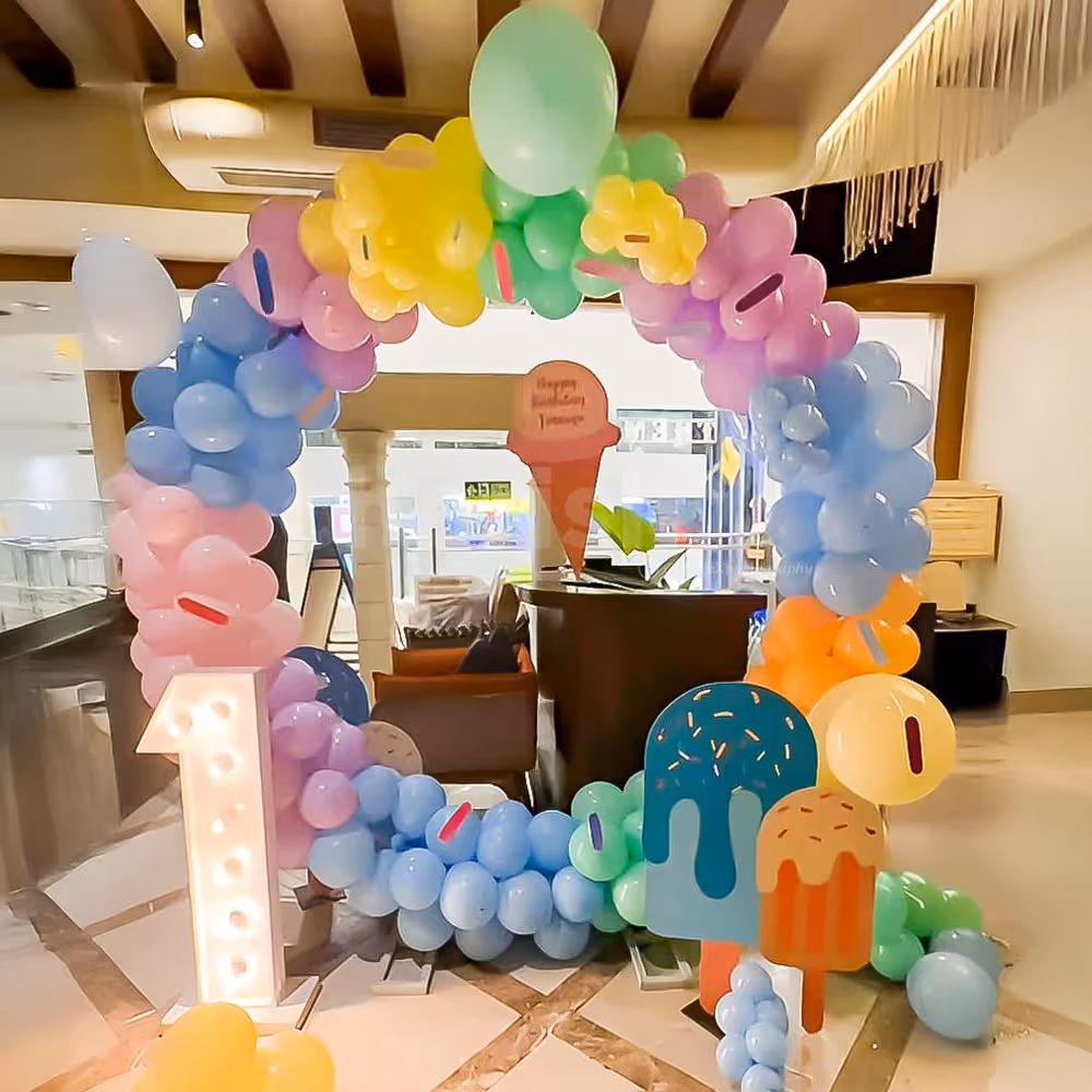 Balloons in different pastel shades and ice cream are the best decor known