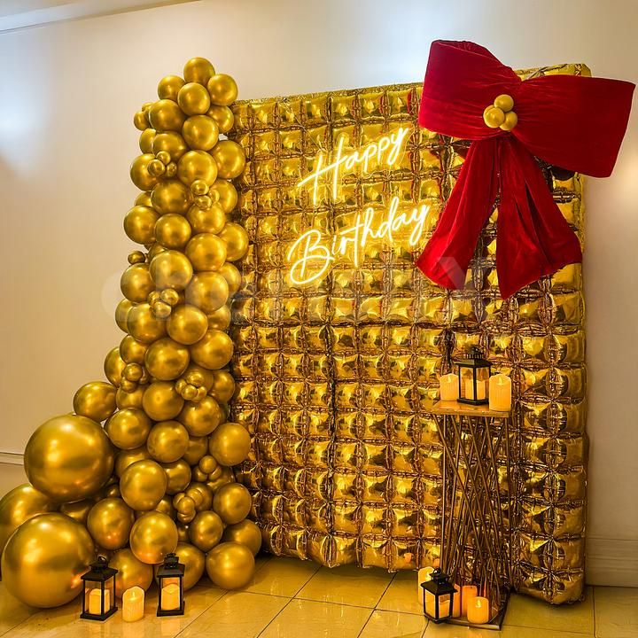 Large red bow makes this decor an Instagrammable backdrop in a golden tone