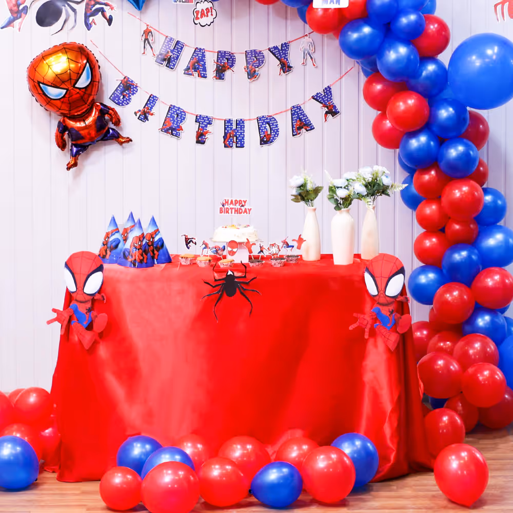 From red balloons to cutouts this hero party spreads joy everywhere