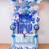 Balloons stars and dreamy swirls together create magical frozen birthday photo vibes