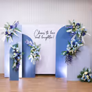 Bright lights colorful flowers and customized banner to celebrate engagement