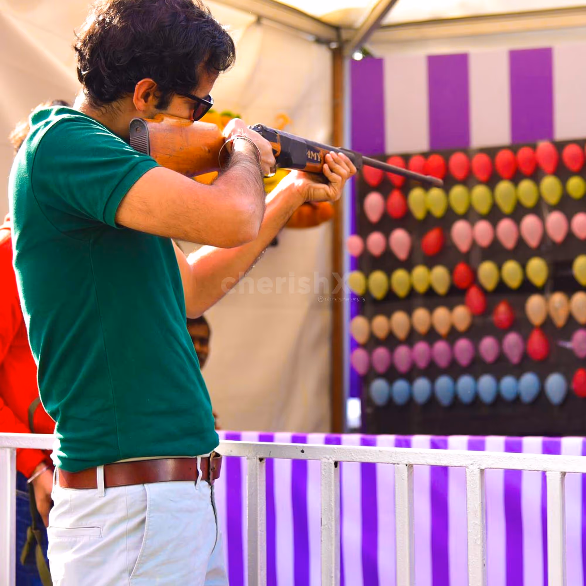 Balloon Shooting Game Rental Setup For Events And Gatherings Keeps Guests Entertained.