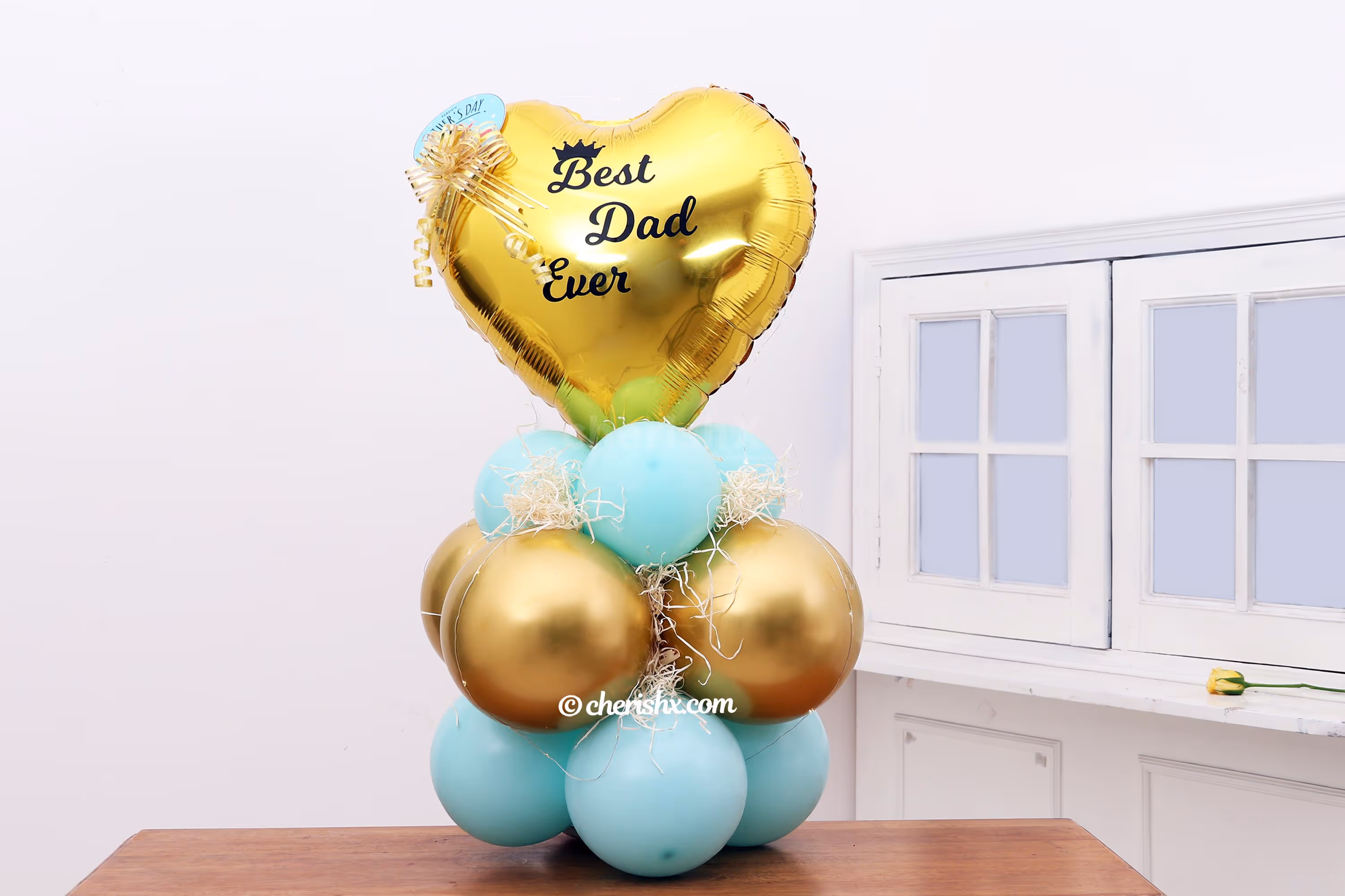 Happy Father's Day Message is also sticked to the heart-shaped Golden Foil Balloon.