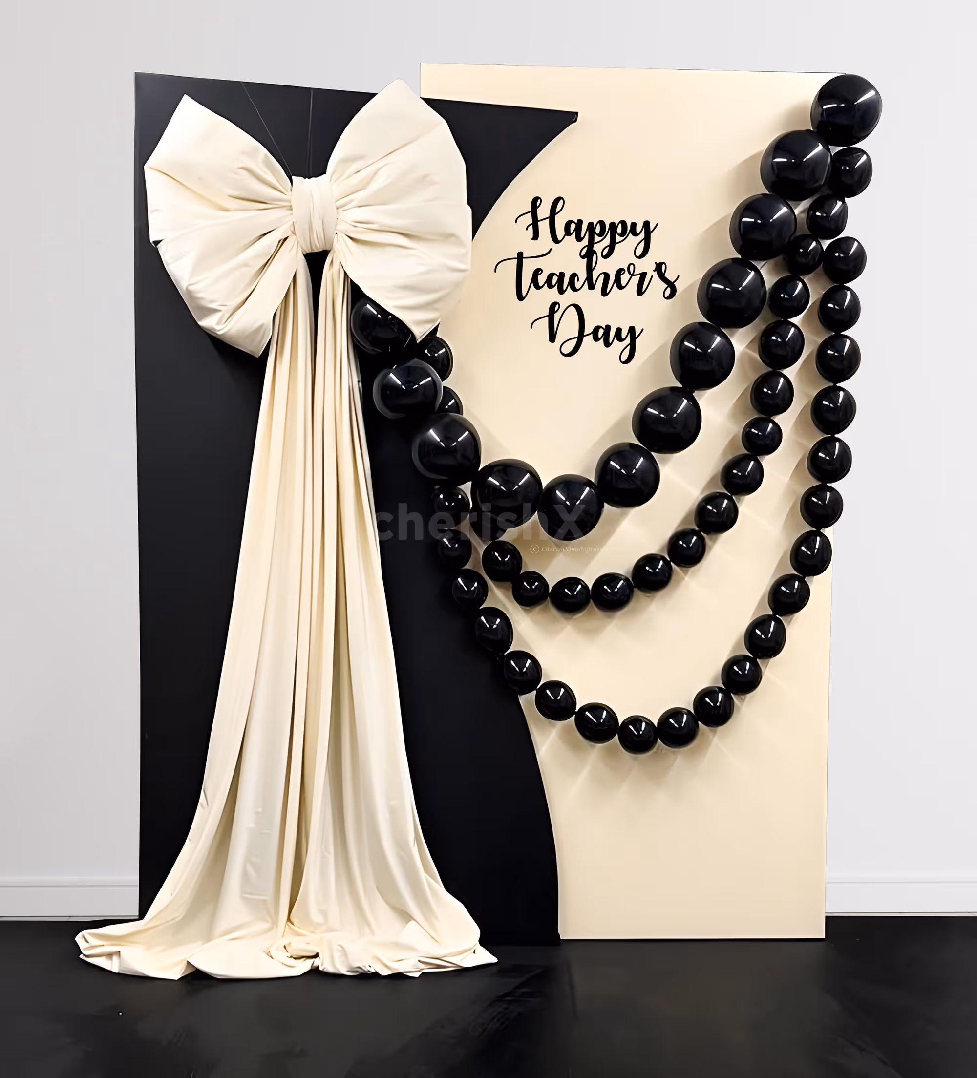 Photo-ready black balloons and sunboard cutouts make a colorful backdrop