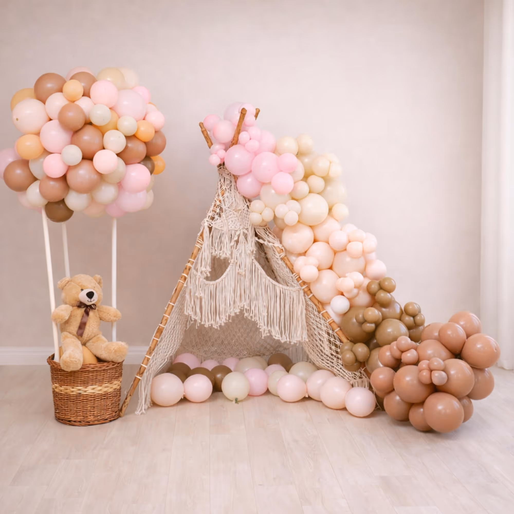 Balloon Arch In Multiple Sizes And Various Tones Of Balloons Adds Grace To A Half-Year Birthday Decor.