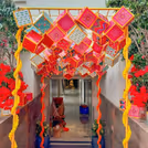 Floral strands add softness to the bold ceiling display.