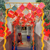 Floral strands add softness to the bold ceiling display.