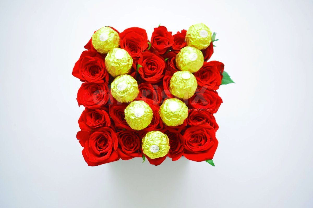 Delightful Chocolate Initial Rose Bucket packed with sweet surprises.