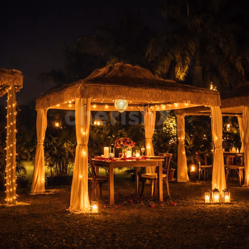 Elegant cabana setup with soft lighting and gourmet dishes for two