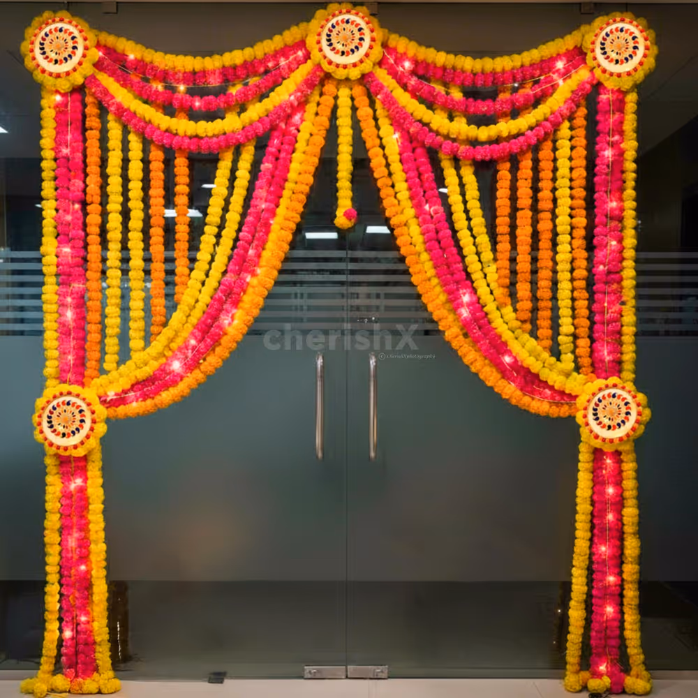 Floral drapes and lights highlight the golden and festive look of the entrance.