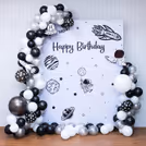 Glowing galaxy flex backdrop under a neon birthday sign.